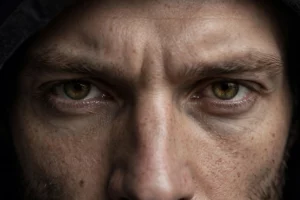 Close-up of deep-set hooded eyes known as hunter eyes